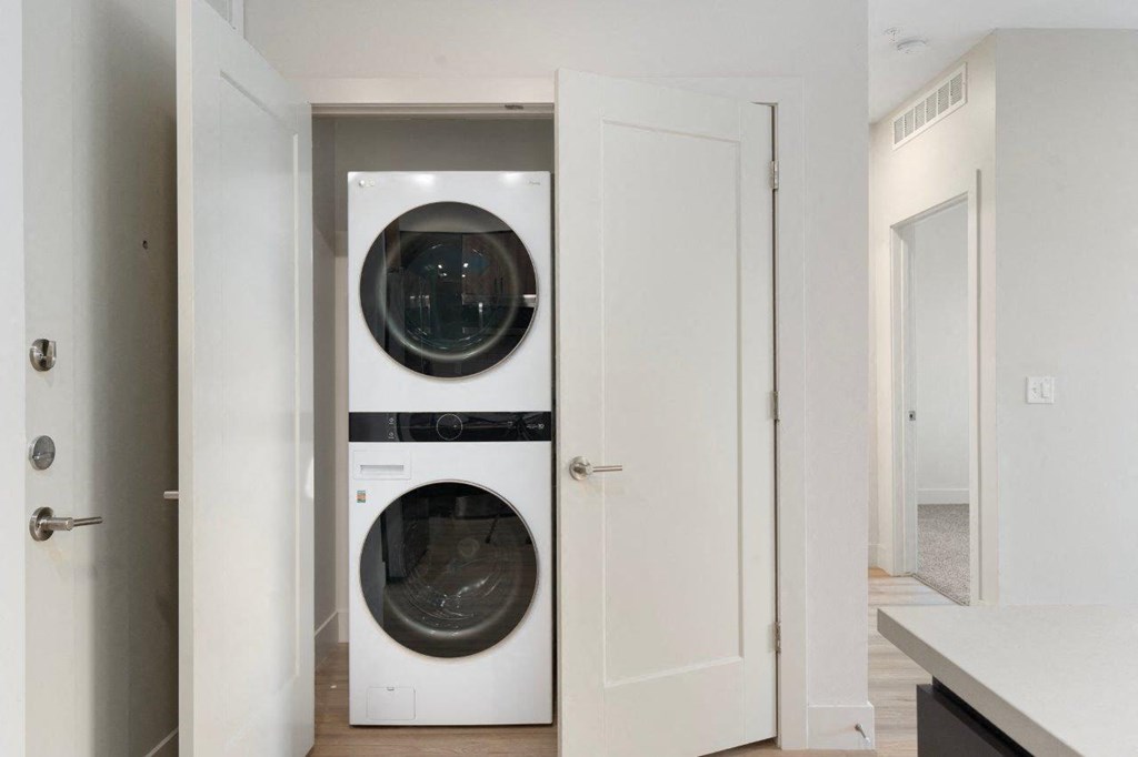 a small laundry room with a washer and dryer in a closet