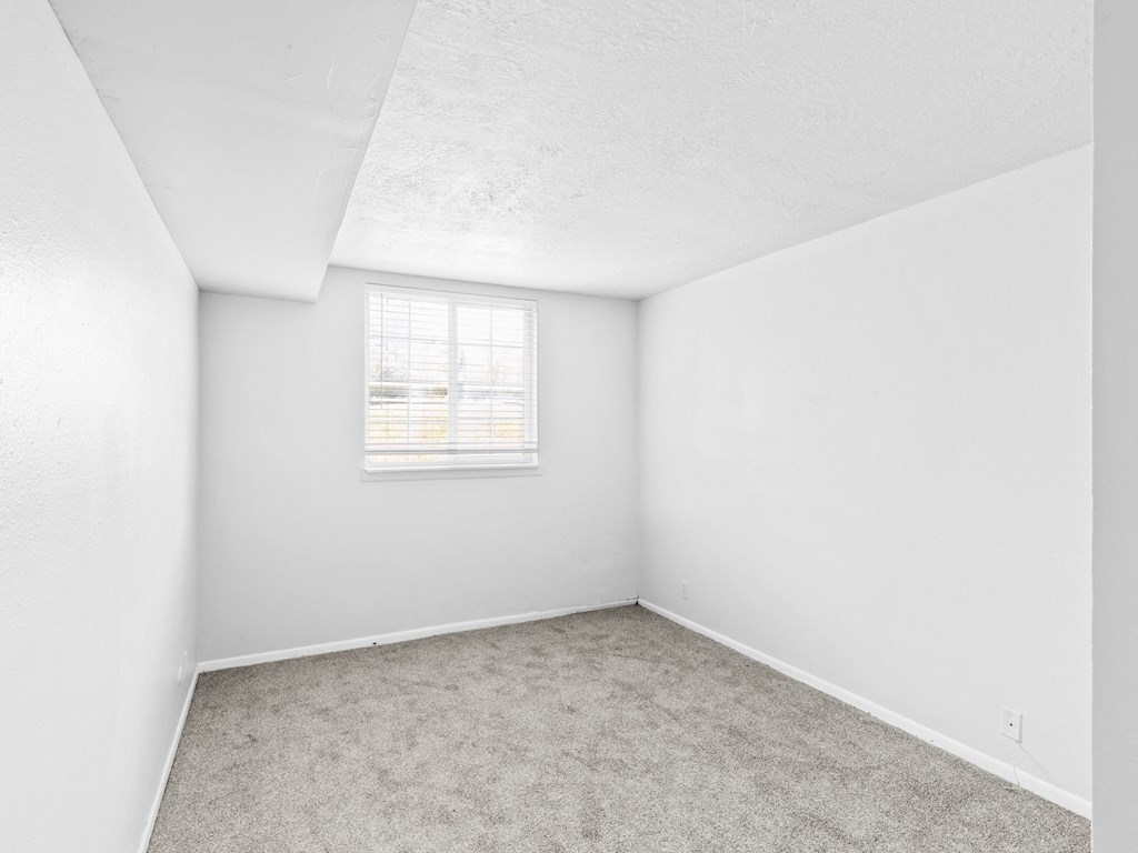 Proximity Apartment Homes Bedroom with Wood like floors