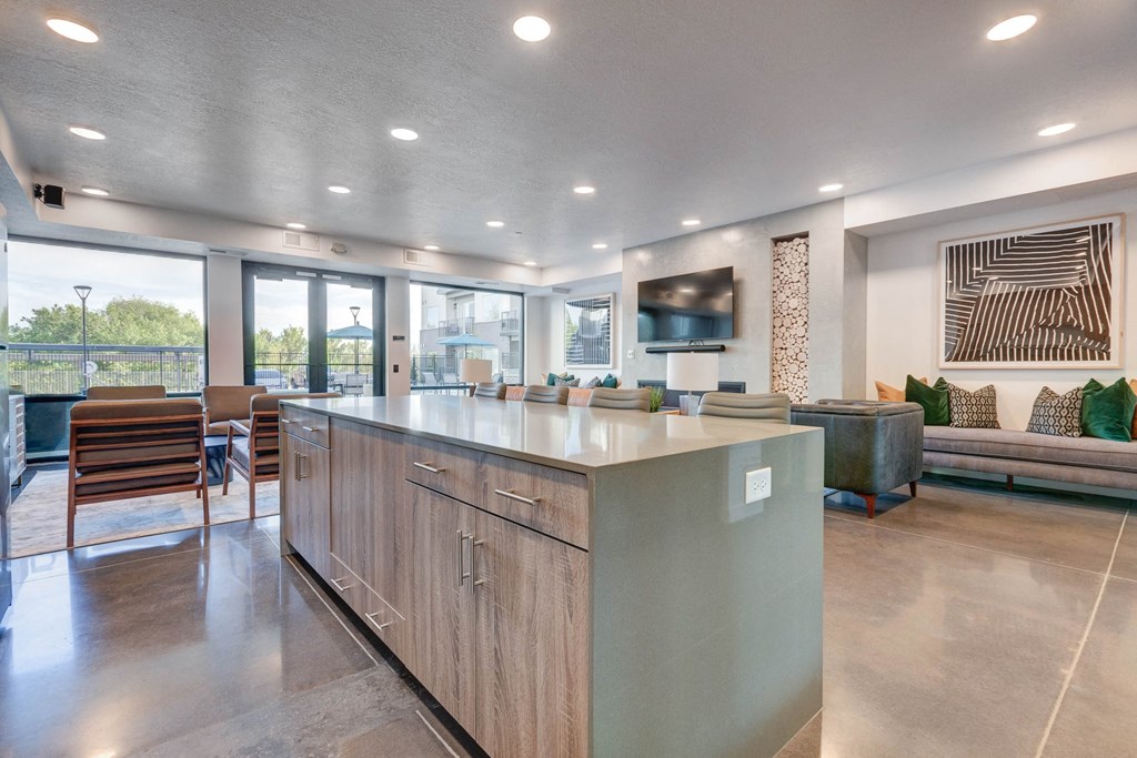 the preserve at ballantyne commons clubhouse with an island kitchen and living room