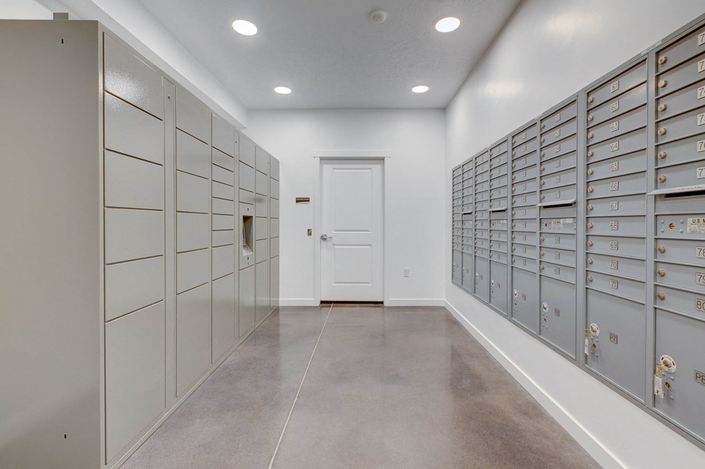 a utility room with many lockers and a door
