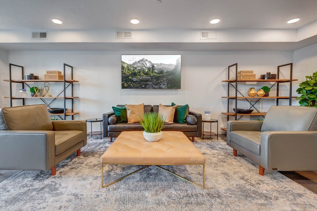 a living room with couches and chairs and a coffee table