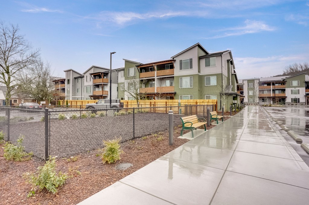 the preserve at ballantyne commons apartments exterior with walkway and benches