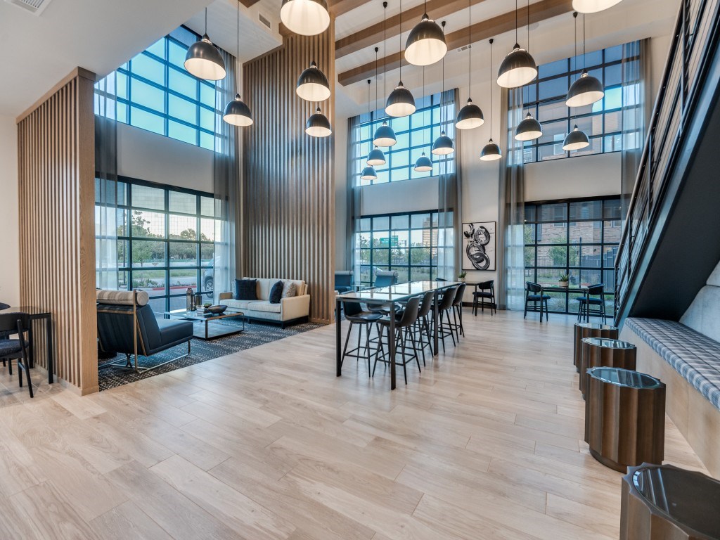 A modern living room with wooden floors and furniture.
