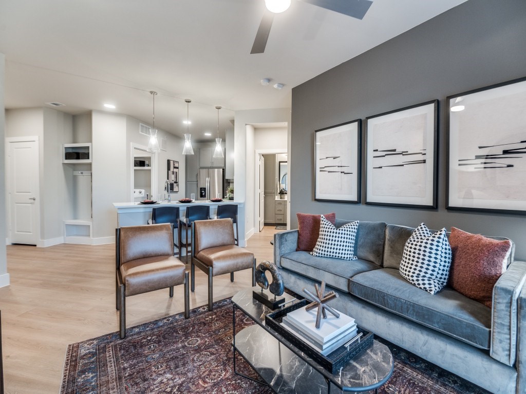 A living room with a grey couch and a coffee table.