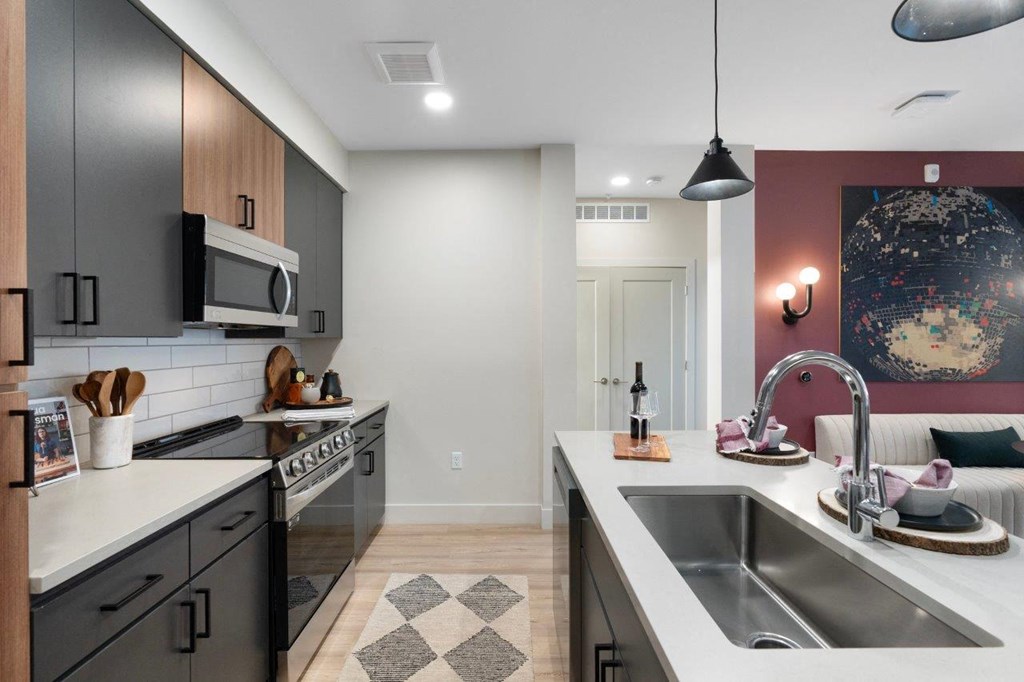 a kitchen with stainless steel appliances and a sink