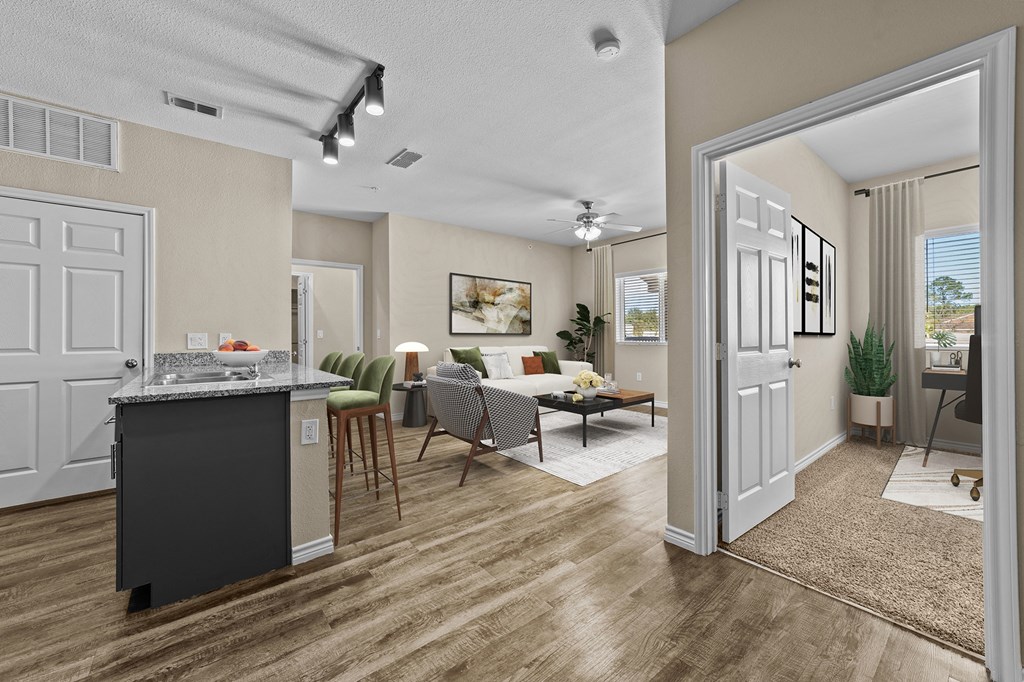 A kitchen with a dining table and chairs is shown.