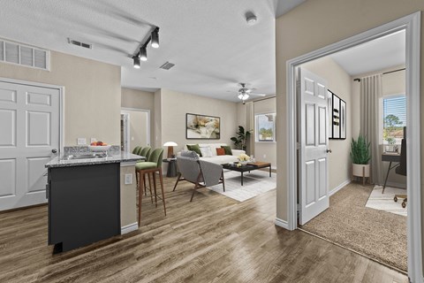 A kitchen with a dining table and chairs is shown.