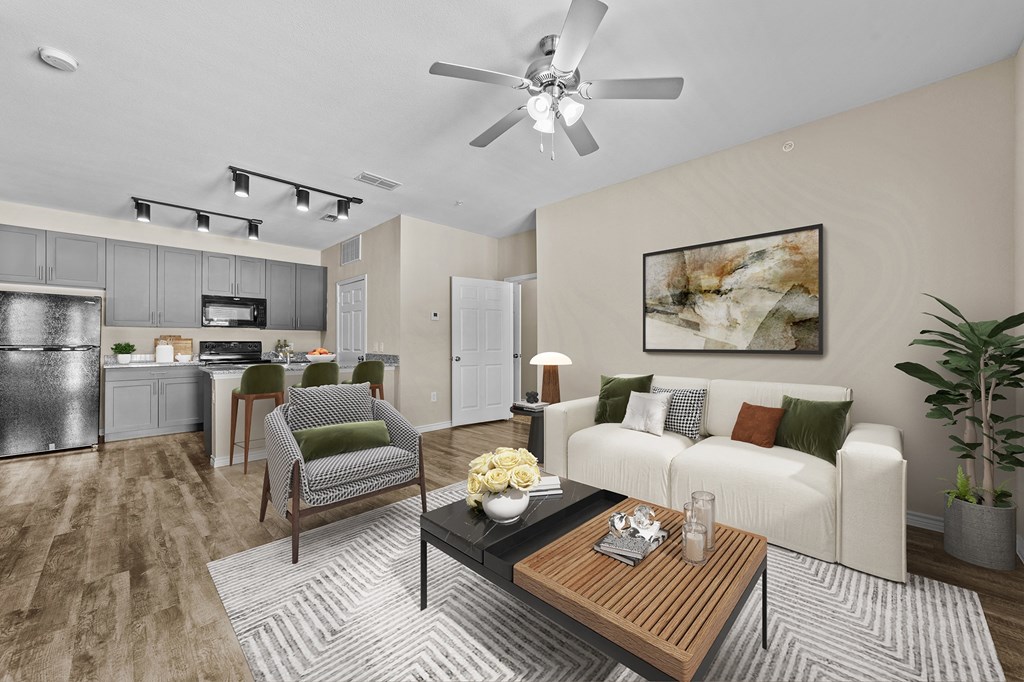 A modern living room with a white couch and a wooden coffee table.