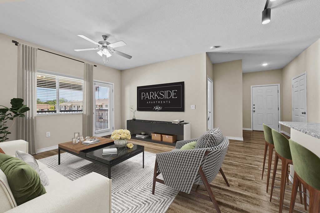 A living room with a sofa, chairs, and a coffee table.