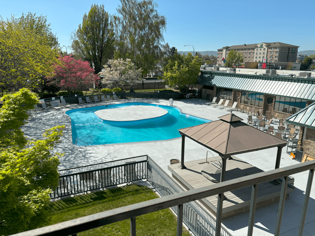 9 North Apartments pool with lounge chairs