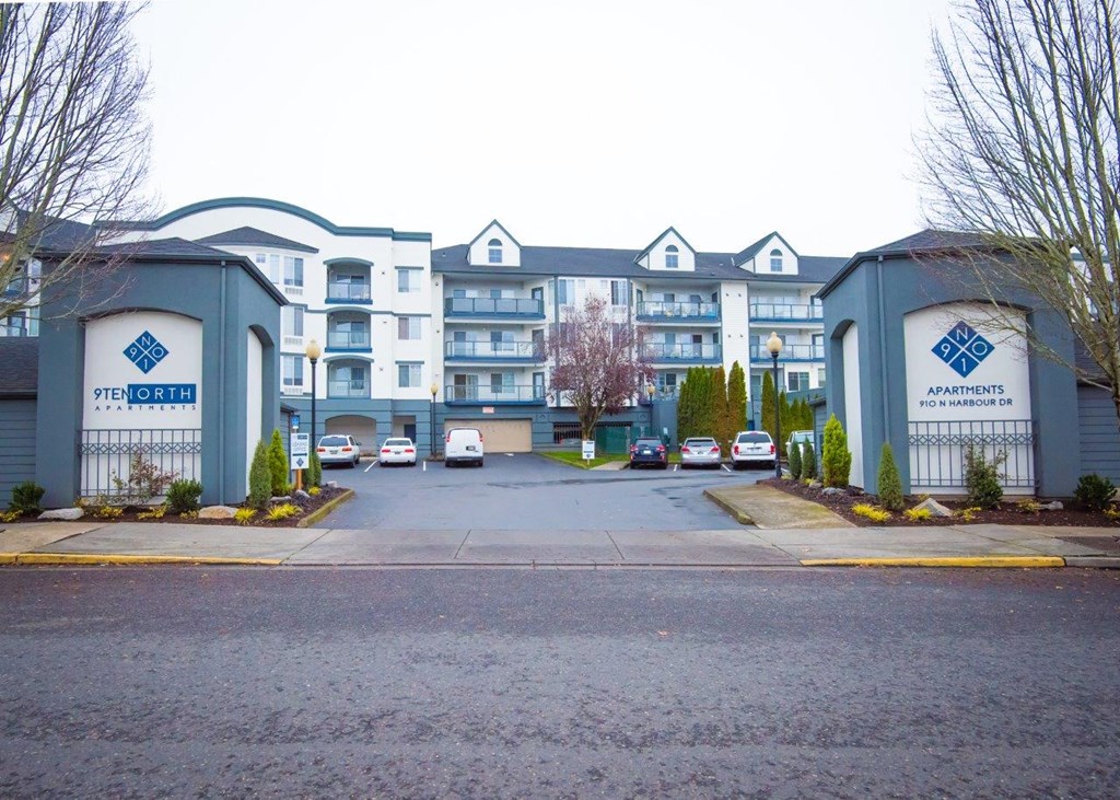 a large building with a parking lot in front of it