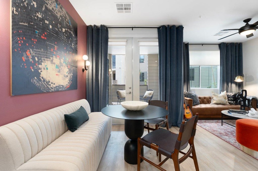 a living room with a white couch and a table