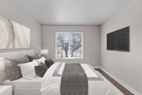 an image of a bedroom with a bed and a window