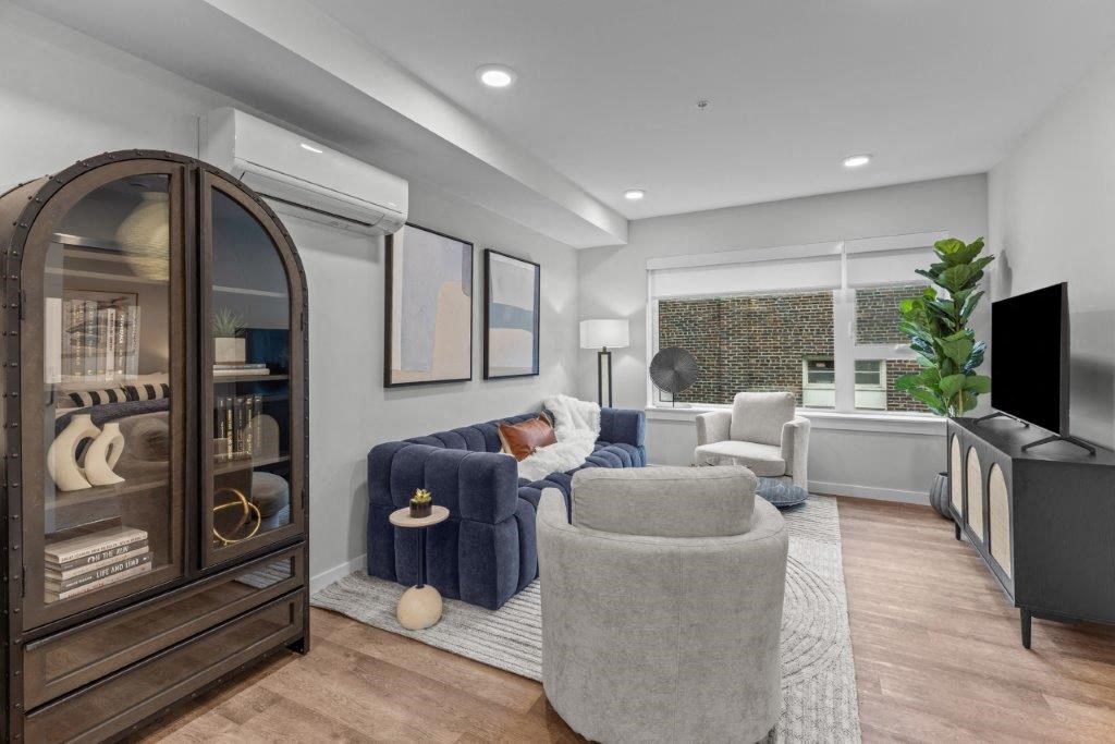 a living room with a couch and a tv