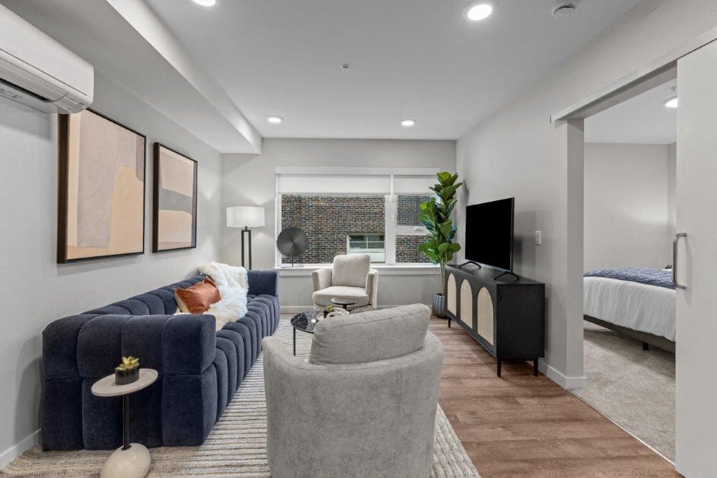 a living room with a couch and a tv