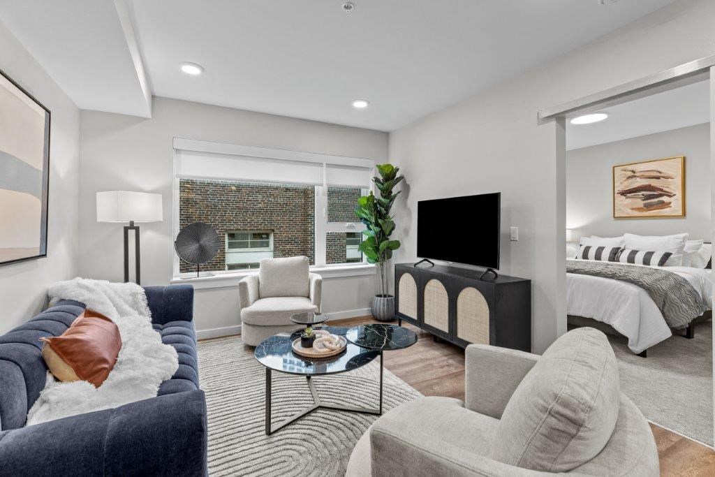 a living room with a couch and a television