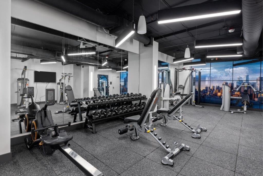 a rendering of a gym with weights and cardio equipment