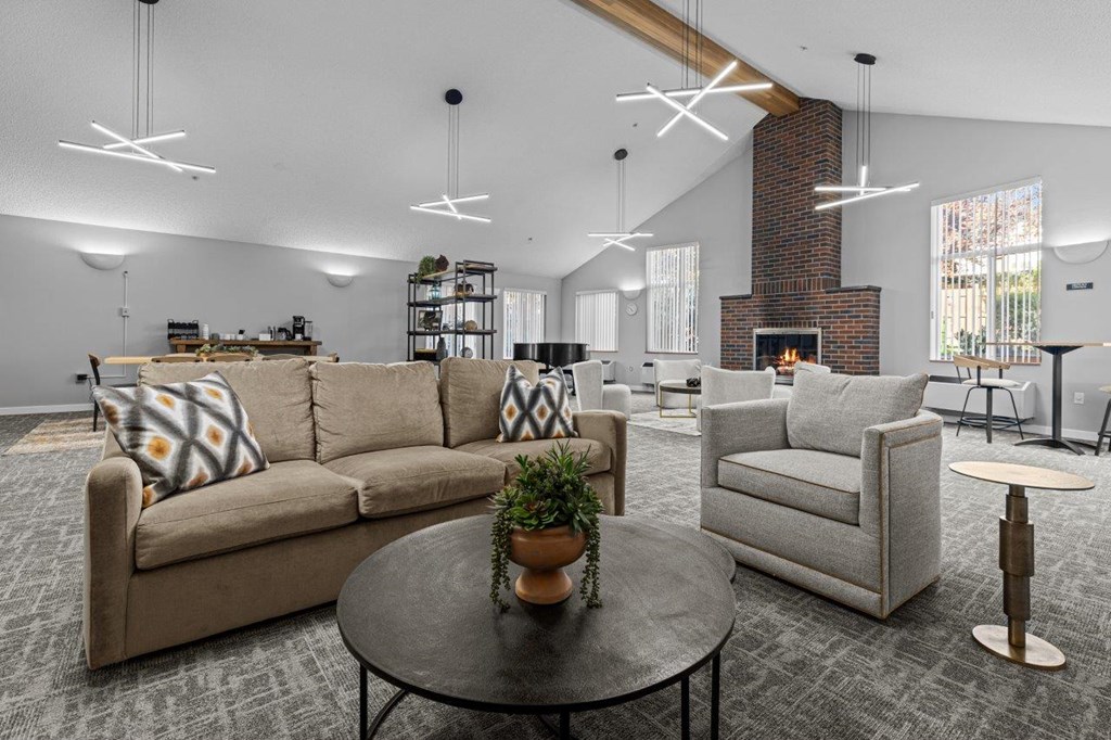 A living room with a couch, chair, and coffee table.