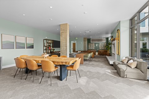 a dining room with a wooden table and chairs