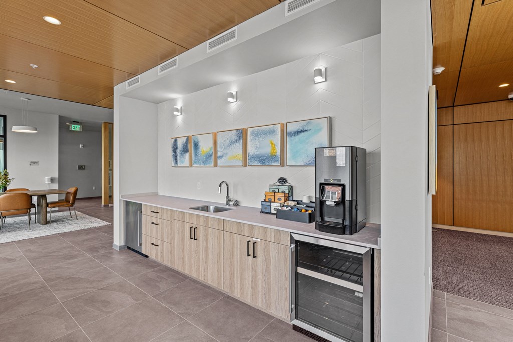 the preserve at ballantyne commons clubhouse kitchen with coffee machine and sink