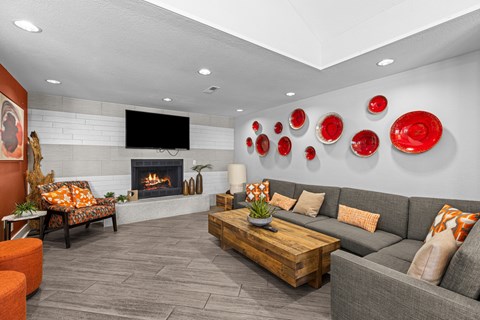 a living room with couches and a fireplace