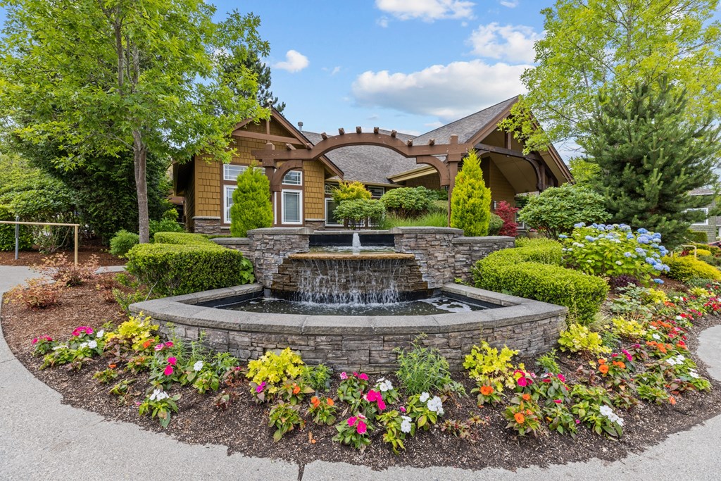 a fountain in front of a house