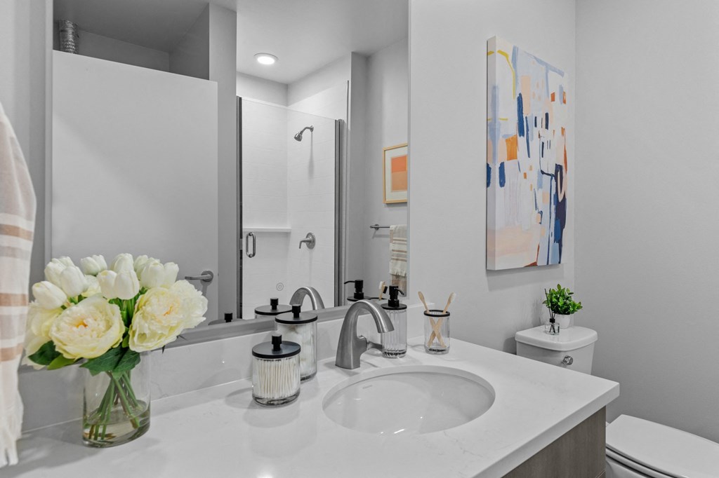 Gridline Apartments Bathroom with white counters