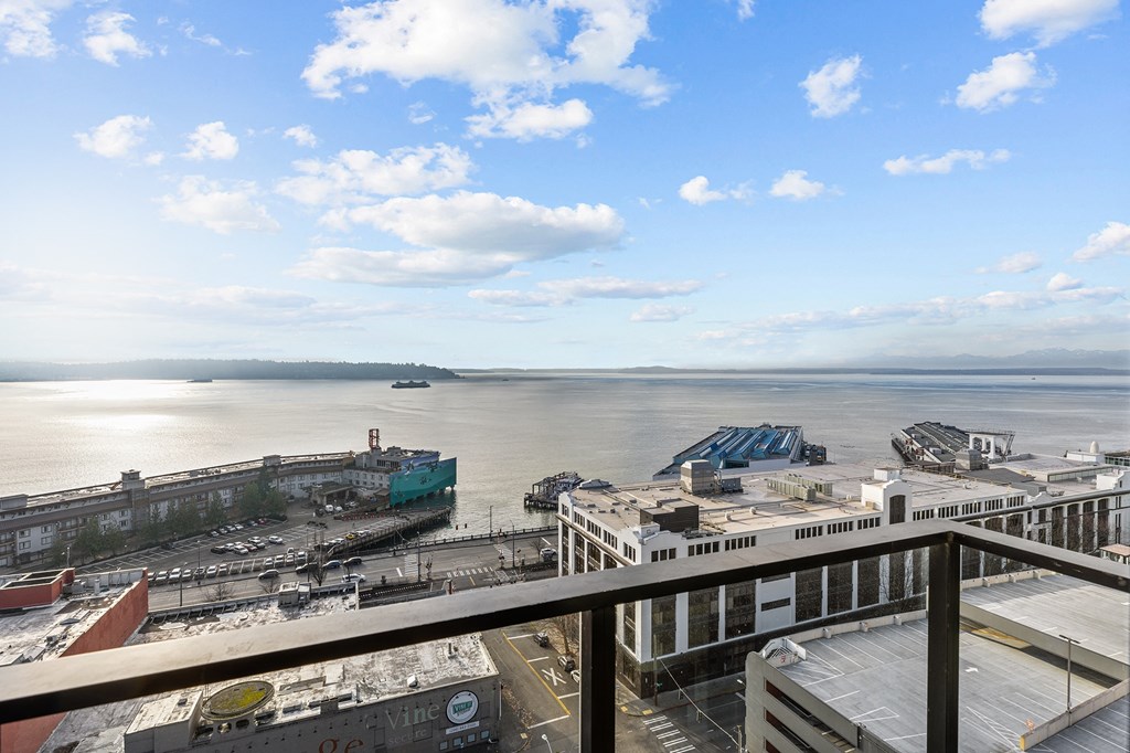a view of the water from a high rise building overlooking a city and the harbor