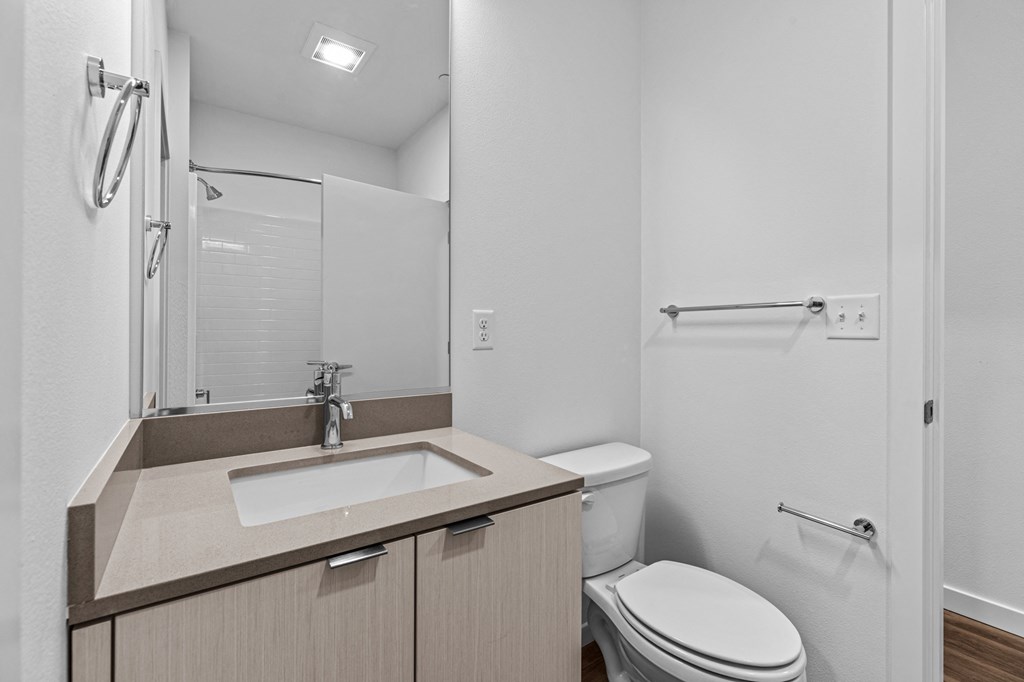 a bathroom with a sink toilet and a shower