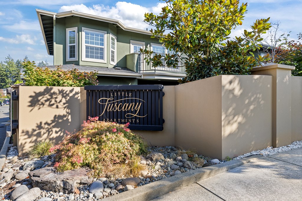 Little Tuscany Apartments & Townhomes - Townhome Exterior with Sign