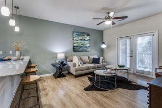 Landmark Conservancy Model Living Room with Private Patio