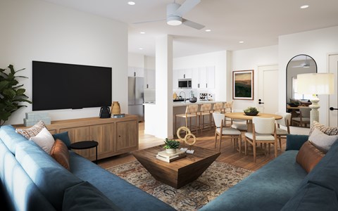 A modern living room with a large TV and comfortable seating.