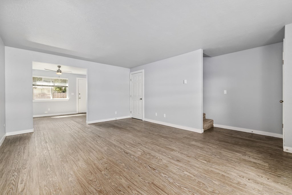North River Apartments living room with white walls and wood floors