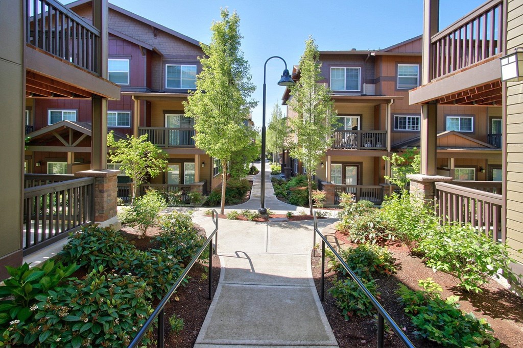 Sunset Crossing Apartments exterior with walkway