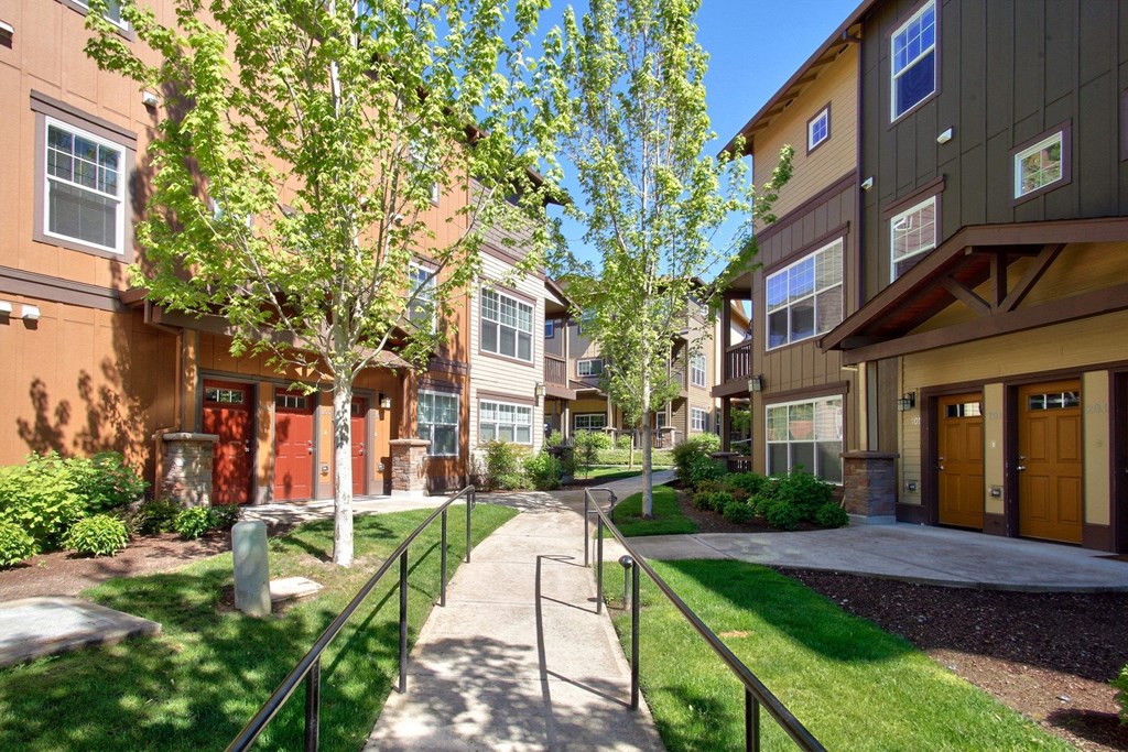 Sunset Crossing Apartments exterior with walkway