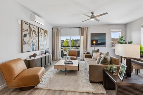 A living room with a brown leather chair and a coffee table.