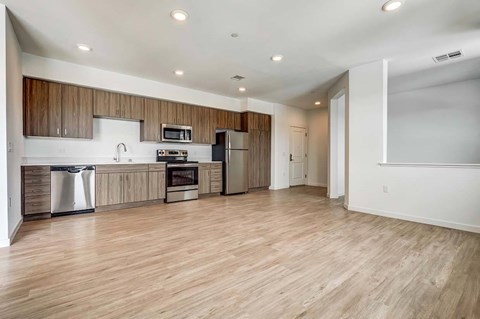 A kitchen with wooden cabinets and a white countertop.