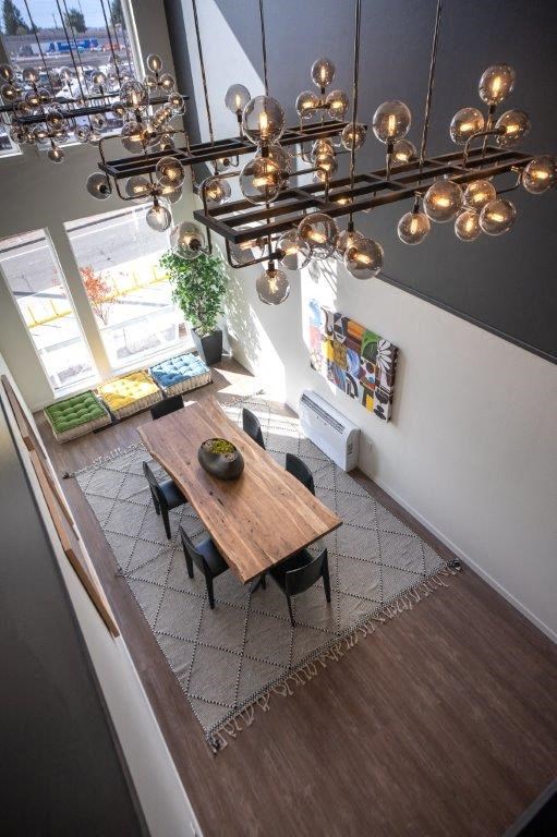 a dining room with a table and chairs and a chandelier