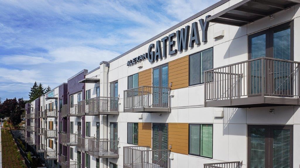 a building with balconies and a sign on it