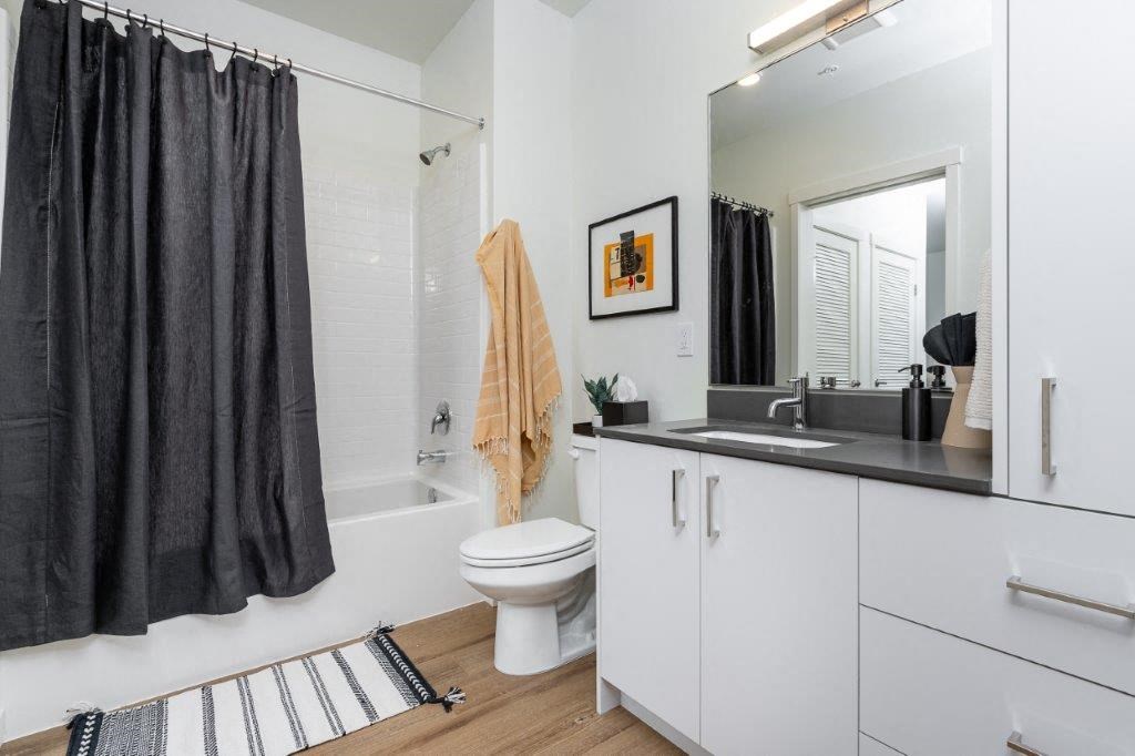 a bathroom with a sink toilet and a shower