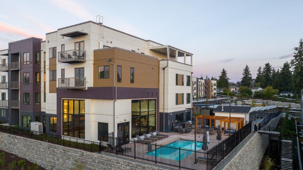 a building with a swimming pool in front of it