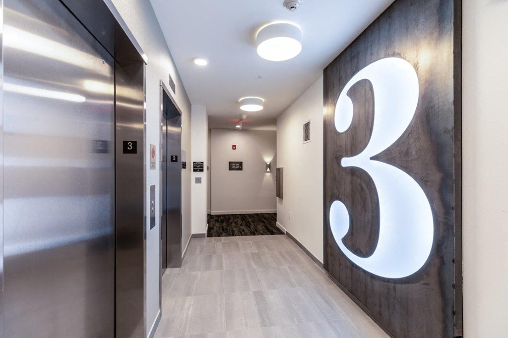 Alexan 100 Apartments Elevators and Hallway