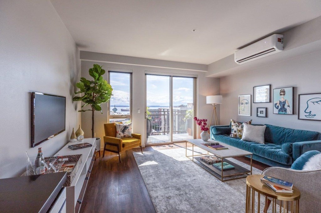 Alexan 100 Apartments Model Living Room and Balcony Door