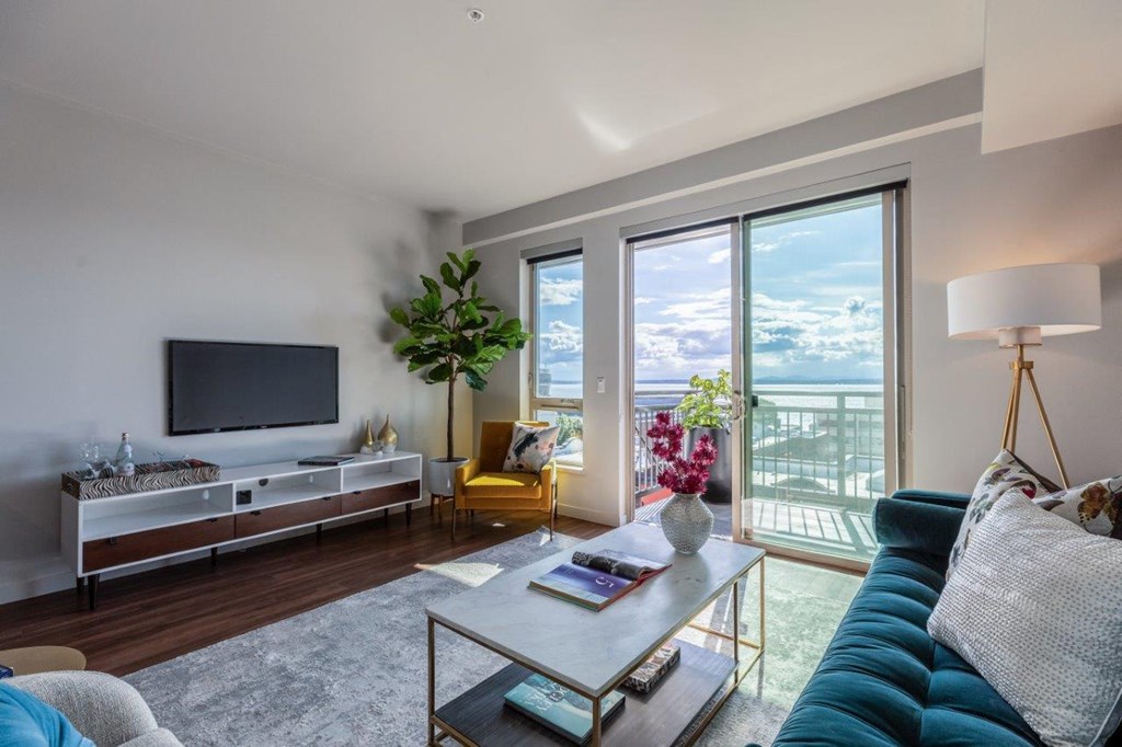 Alexan 100 Apartments Model Living Room and Balcony