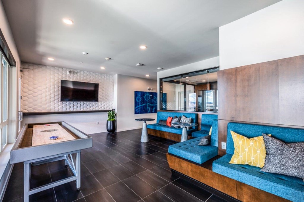 Alexan 100 Apartments Clubhouse and Shuffleboard Table