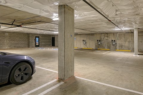 a parking garage with a car parked in it