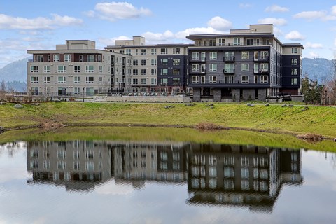 a building reflected in a body of water
