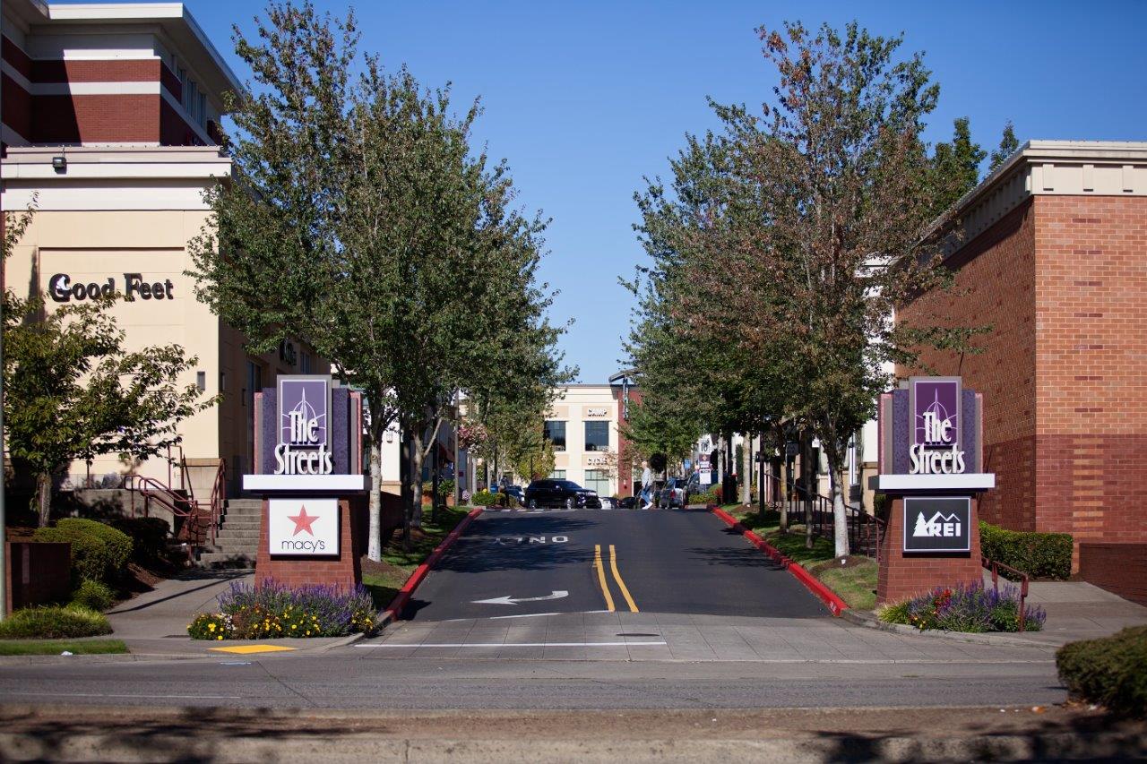 Sunset Crossing Apartments exterior street and sign
