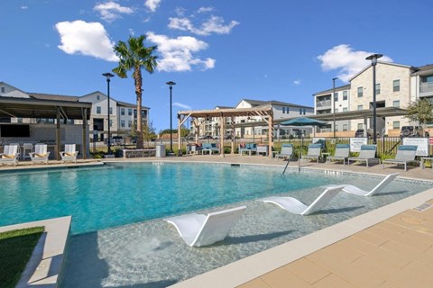 Alta Center Point Apartments in San Marcos, Texas Pool with Lounge Chairs