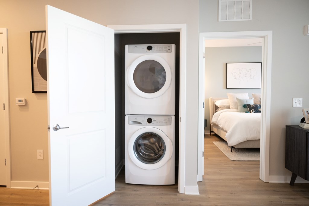 A white washer and dryer in a laundry room.